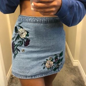 Denim mini skirt with floral embroidered detail
